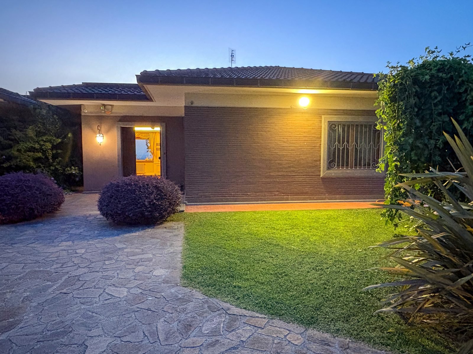The guest house entrance at dusk