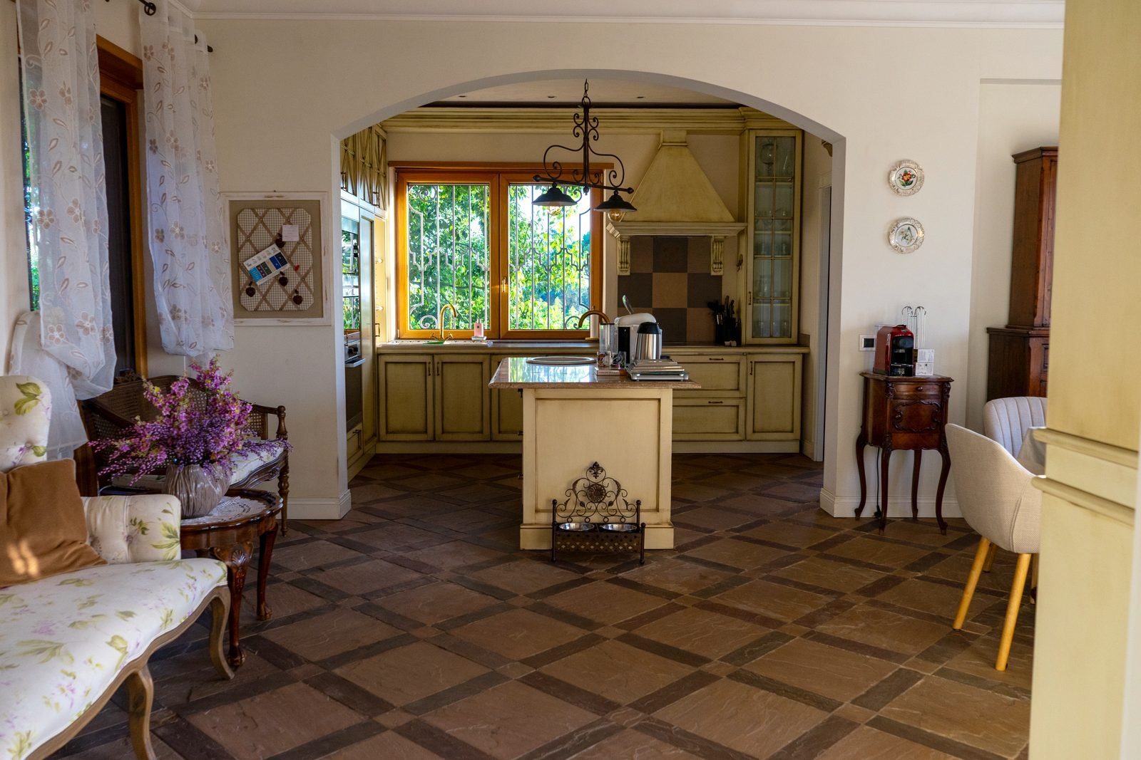 The kitchen with its island and garden window