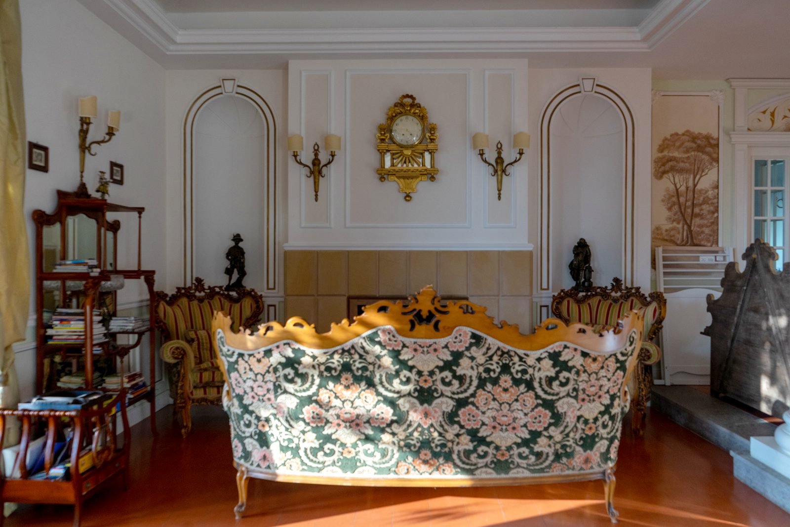 The formal salon with fireplace and gilded clock