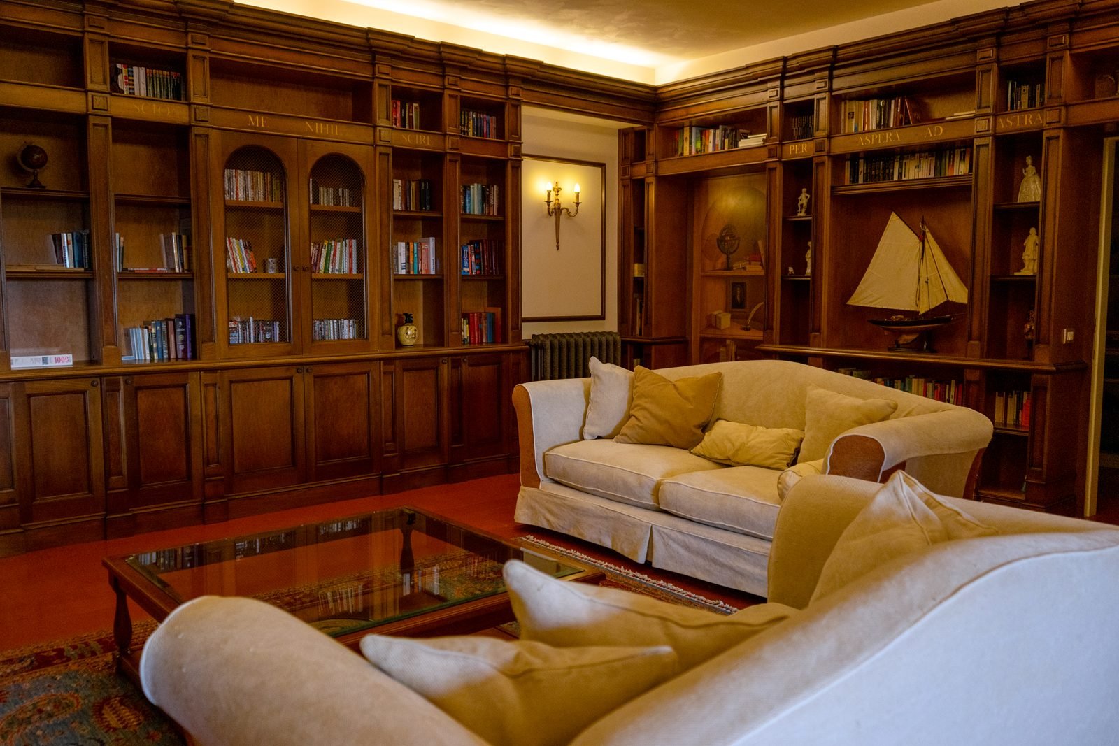 The library with wood-panelled bookshelves