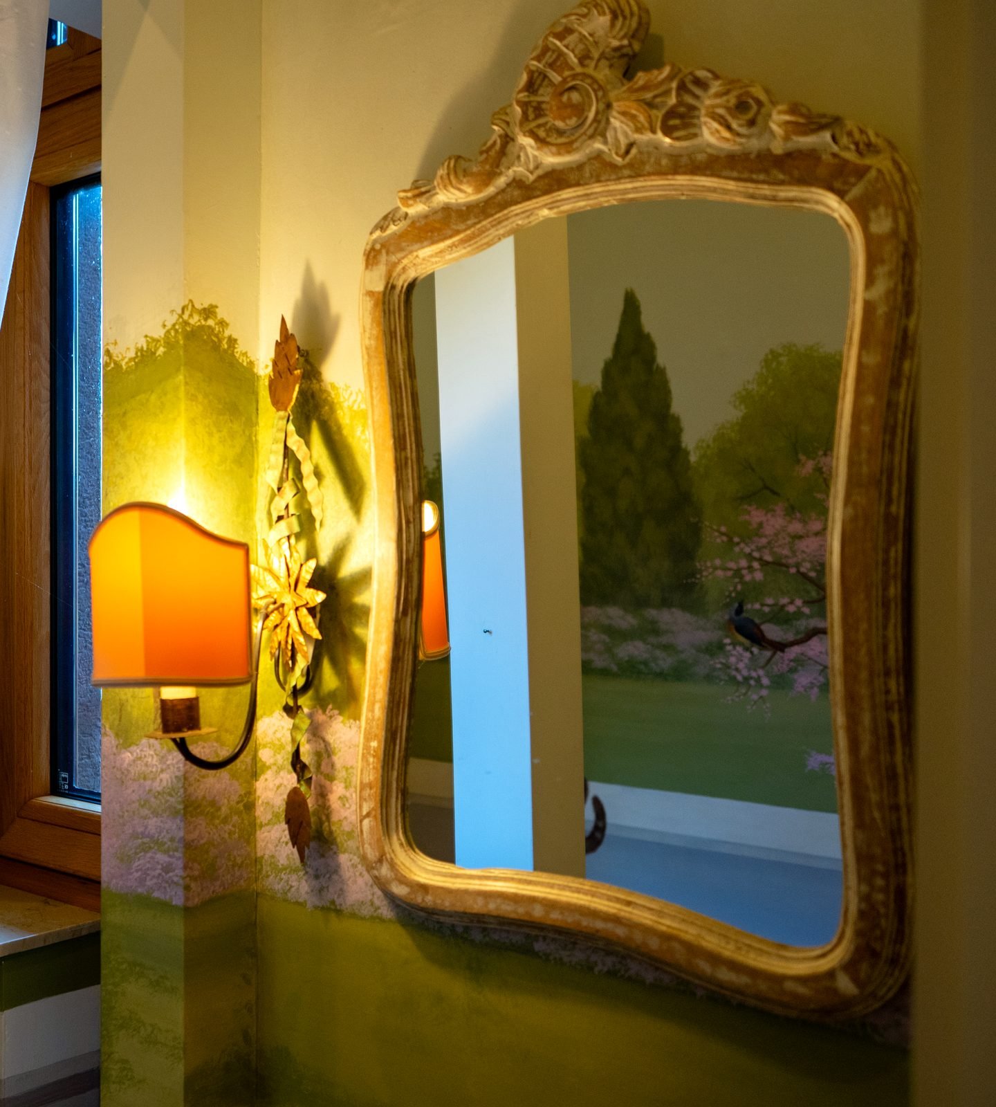 Hand-painted mural and gilded mirror